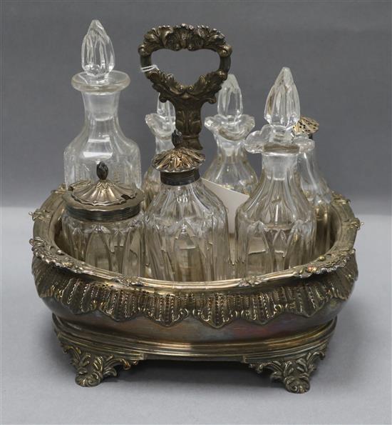 A George IV silver cruet stand, with seven bottles ,three with matching silver mounts, Charles Fox II, London, 1831, 20cm.